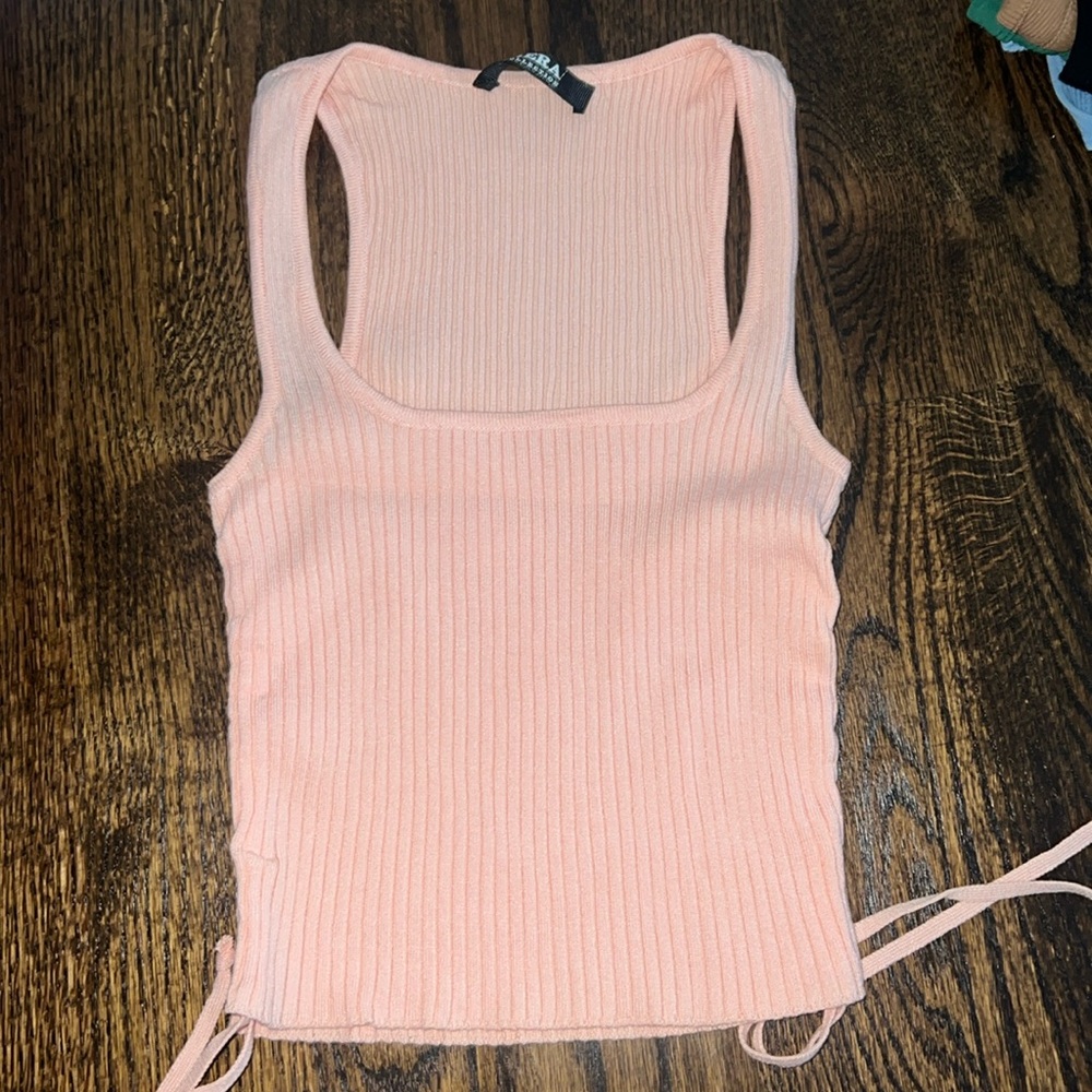Pink/Peach ripped tank top.